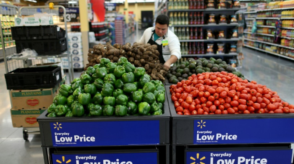 Walmart cuts profit outlook as inflation bites shoppers