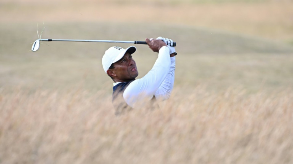 Limping Tiger slumps to six-over on British Open return