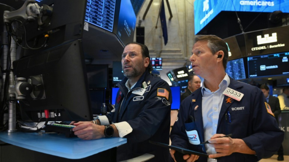 Wall Street termine en hausse, encouragée par la Fed