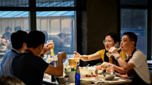 Relief, caution in Beijing as city lifts Covid dine-in curbs