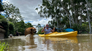 Protesters rally as Australian PM tours flood disaster