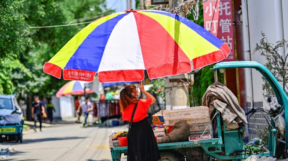 Beijing roasts in record mid-June temperatures