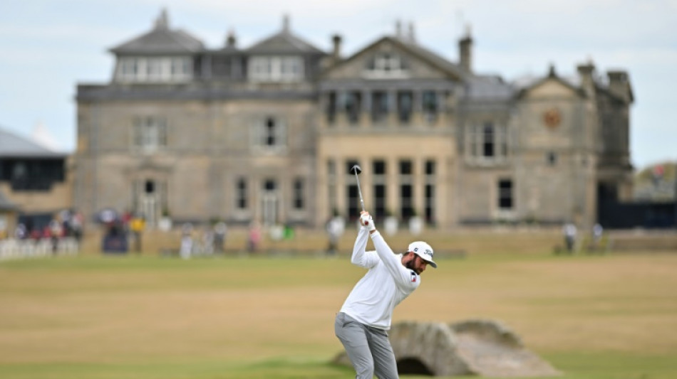 Young leads from McIlroy at British Open but woe for Woods