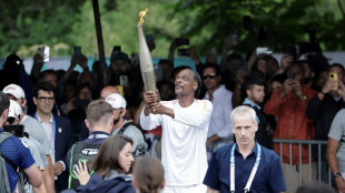 Snoop Dogg stars as flame sails into Paris for opening ceremony