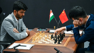 World chess champ Ding, teen challenger tied past halfway mark