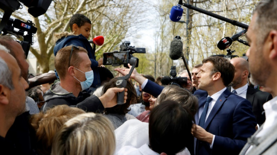 Macron defends pensions shift as French campaign brawl heats up