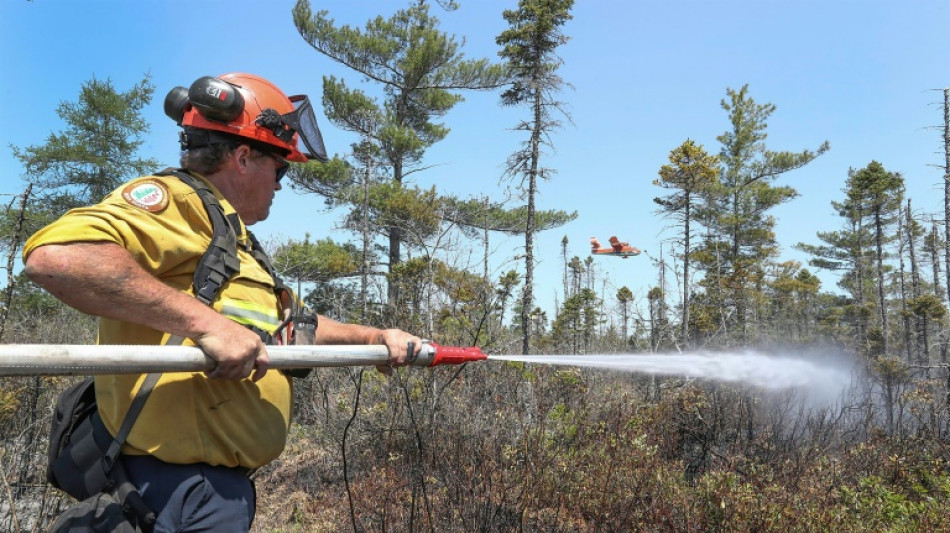 Canada awaits wildfire help, as thousands more may flee